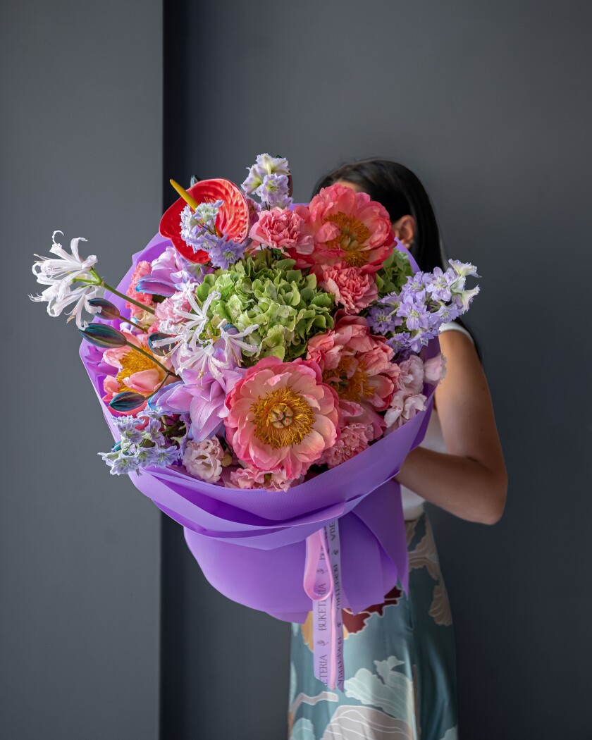 Light pink lisianthus with lavender lilies and coral peonies