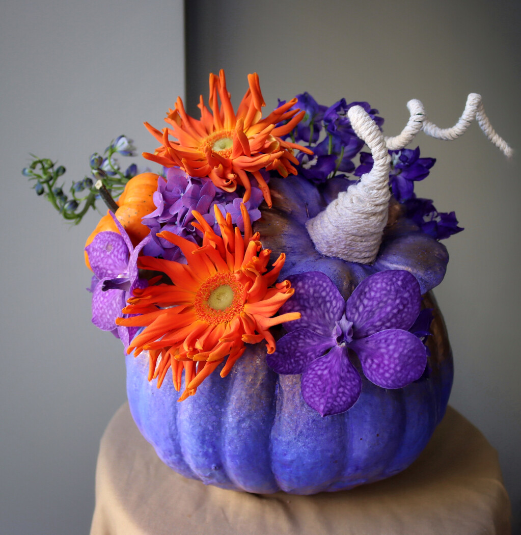 Purple vanda orchid with lilac hydrangea and orange gerbera