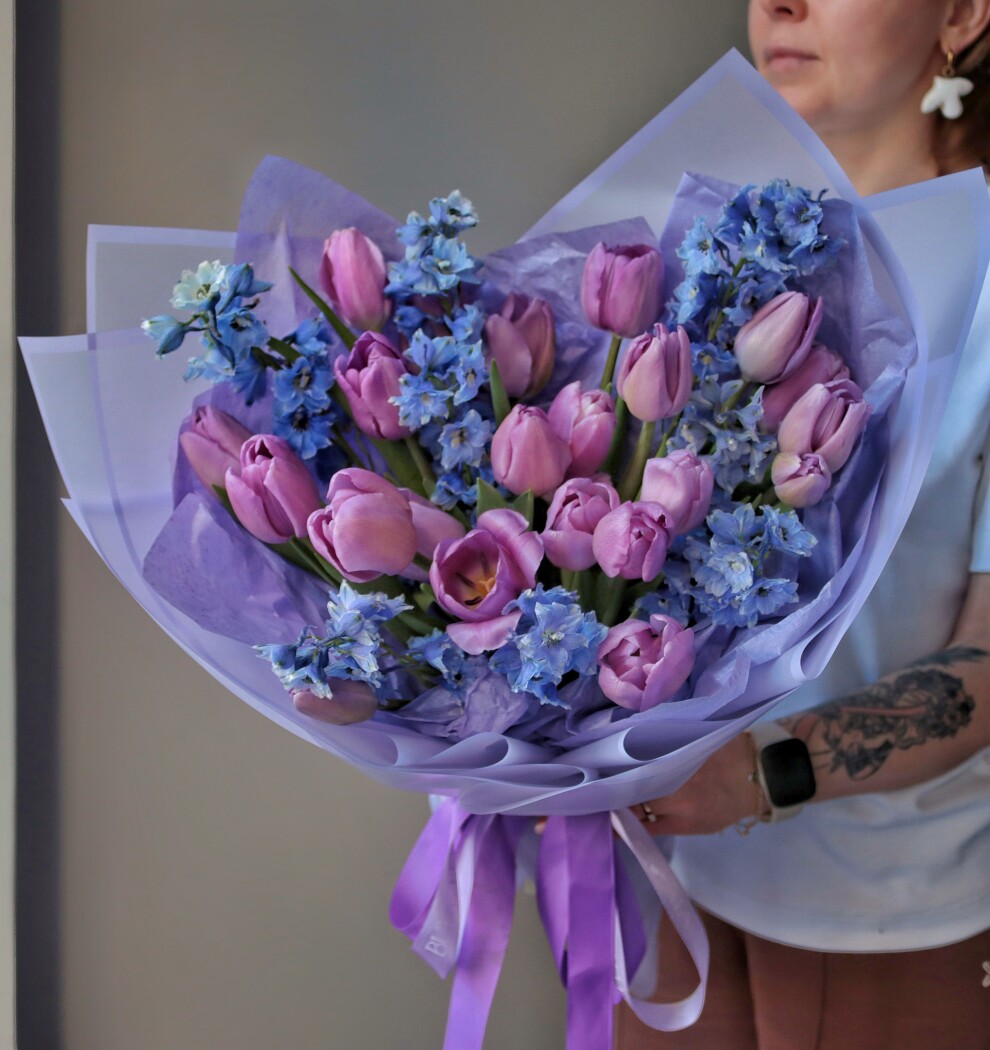 Light blue delphiniums with light pink tulips