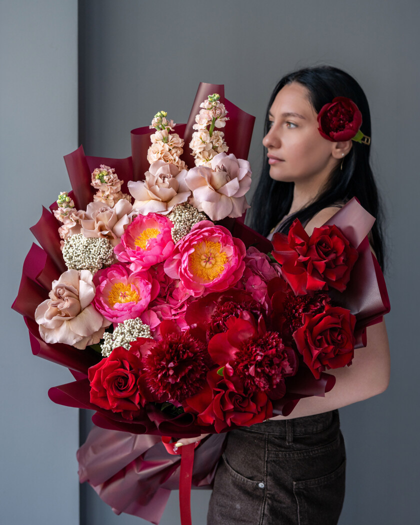 Seven hot pink peonies with pink hydrangeas and burgundy garden roses