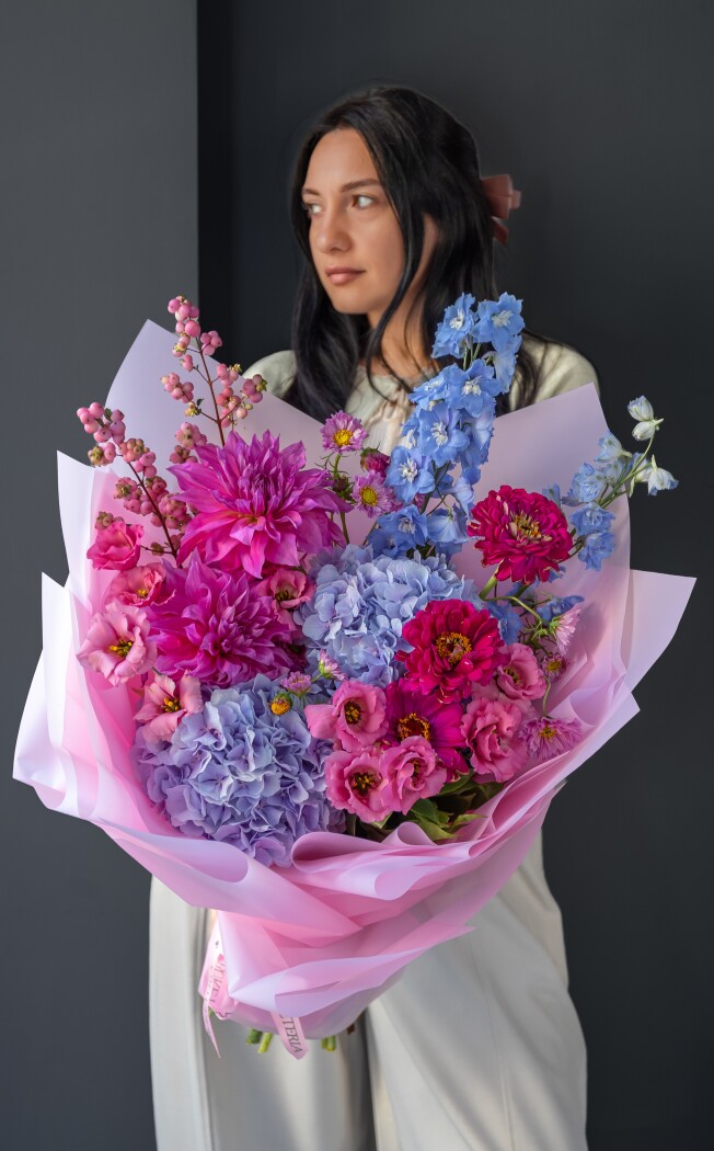 Lilac hydrangeas with hot pink zinnias and blue delphiniums