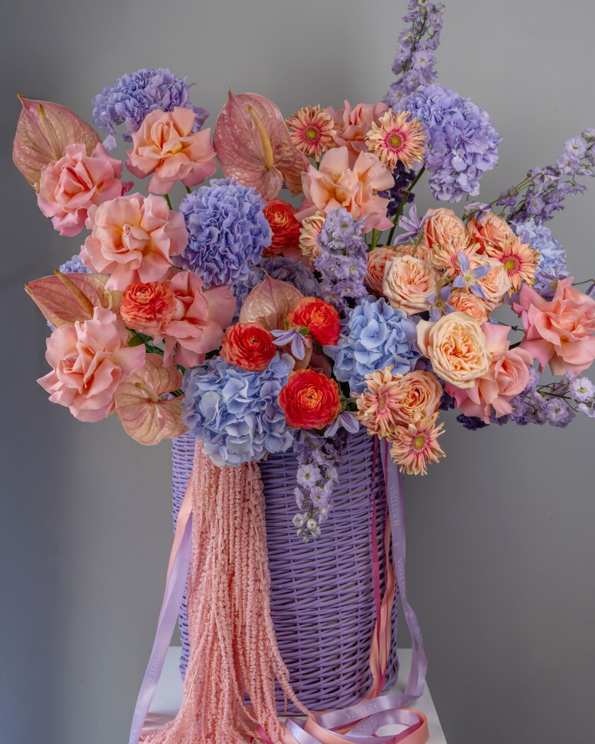 Five lilac hydrangeas with peach garden roses