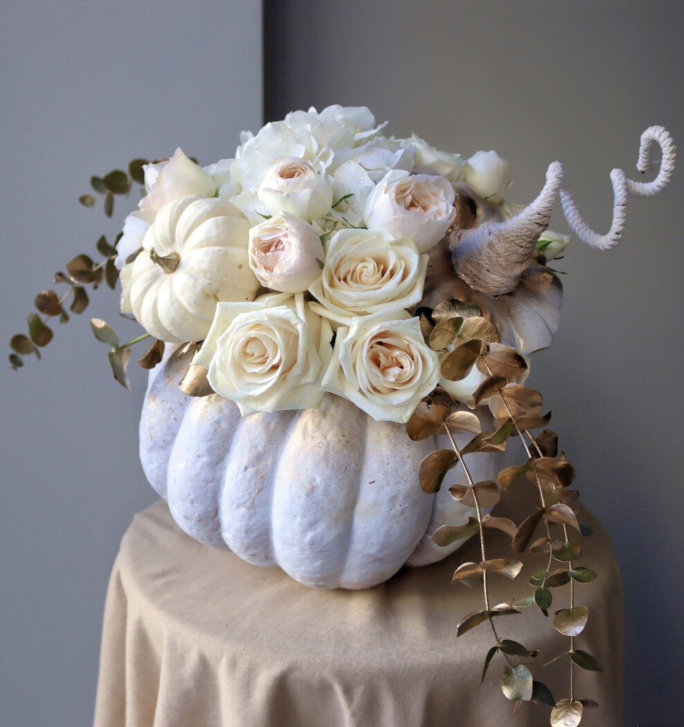 White hydrangea with cream garden roses and pumpkins