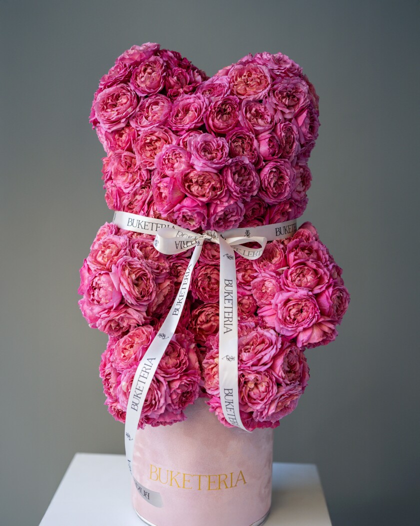 Dusty pink spray roses in a decorative composition