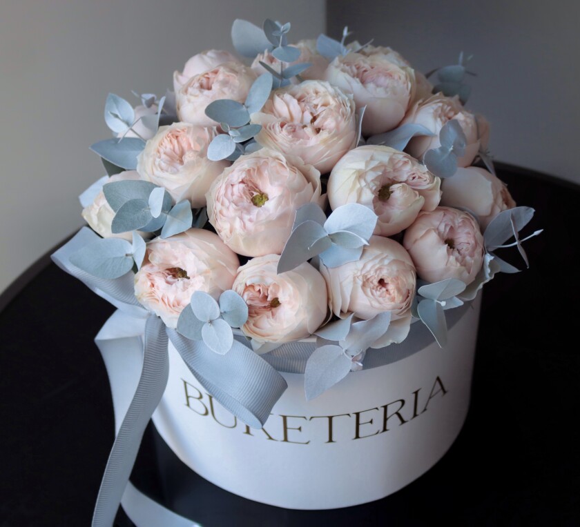 Blush spray roses in a decorative arrangement