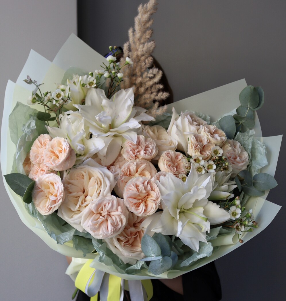 Three blush spray roses with peach garden roses and white oriental lilies