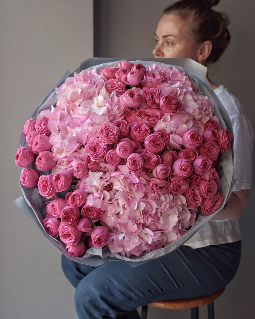 Mixed bouquet of hot pink spray roses and light pink hydrangeas