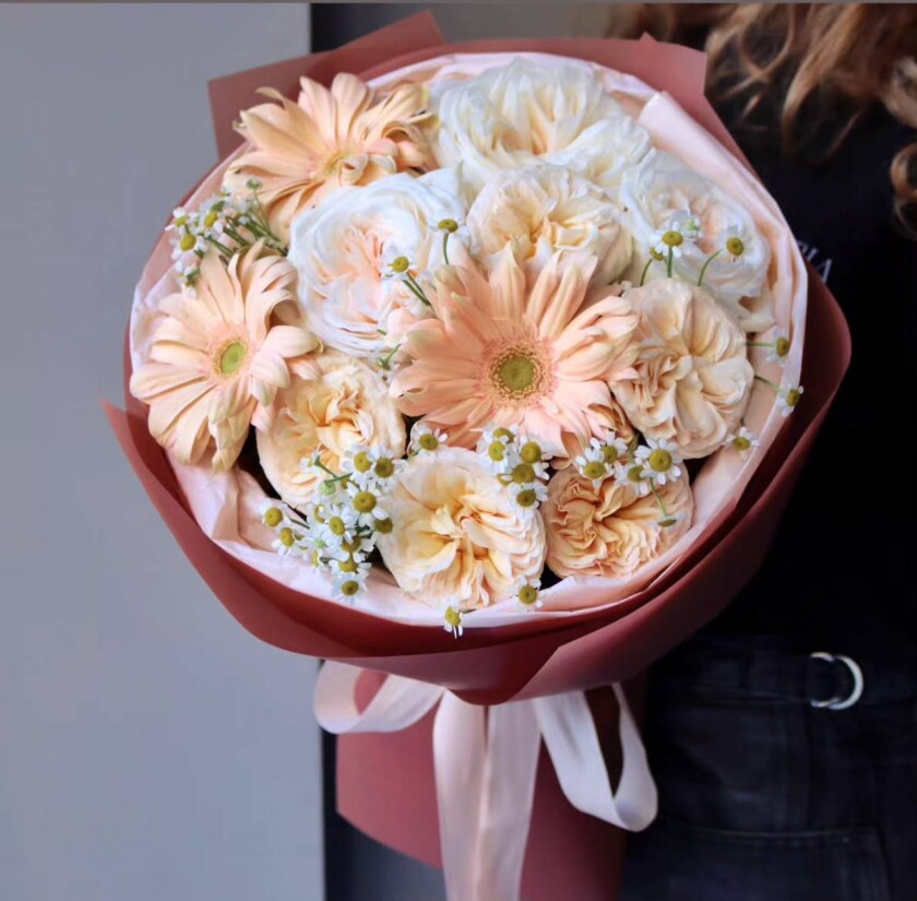Mixed bouquet of cream garden roses and light pink gerberas