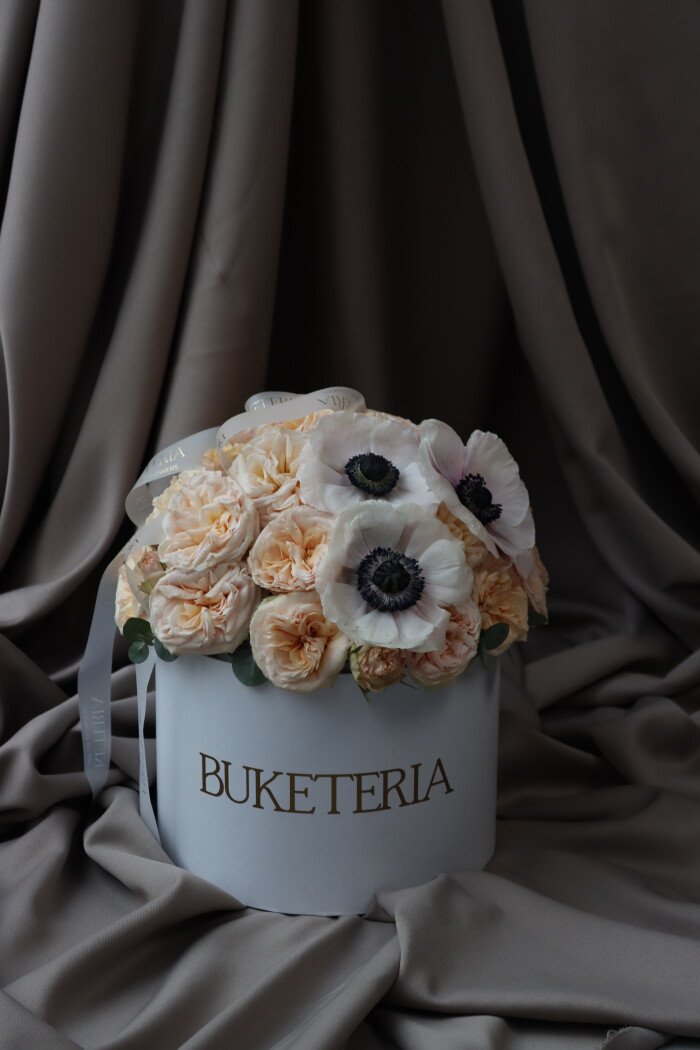 Peach spray roses with white anemones in a box