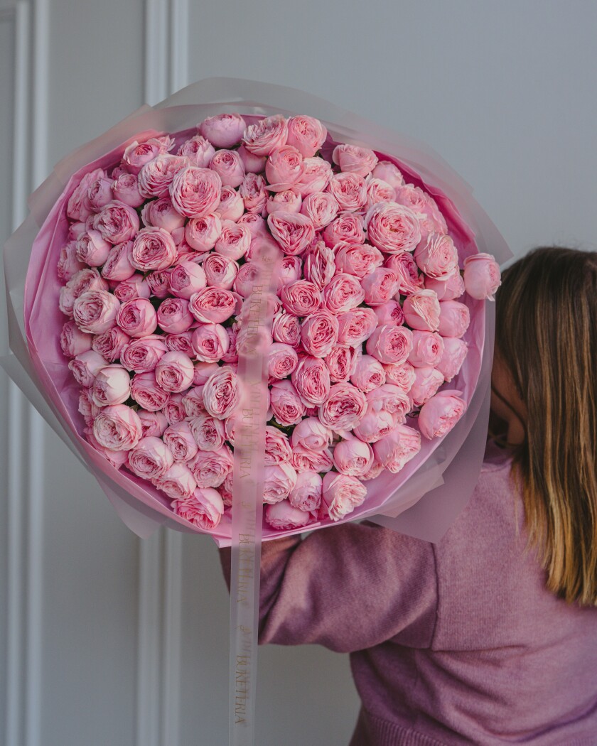 Thirty dusty pink garden roses in waterproof paper