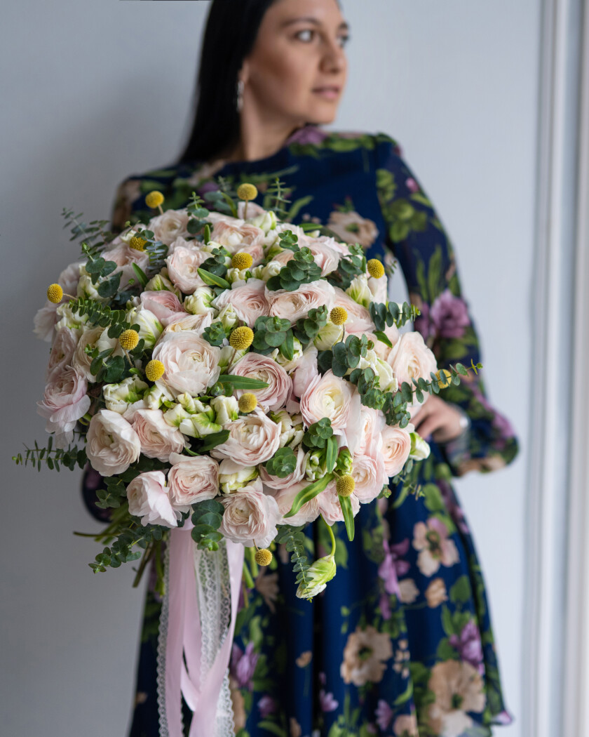 Light pink ranunculus and blush double tulips