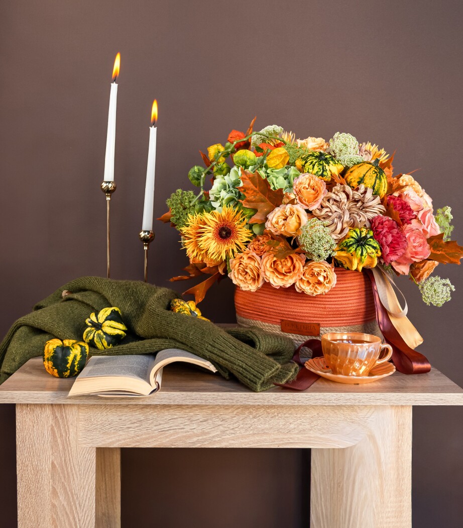 Yellow gerberas with peach garden roses and green hydrangeas