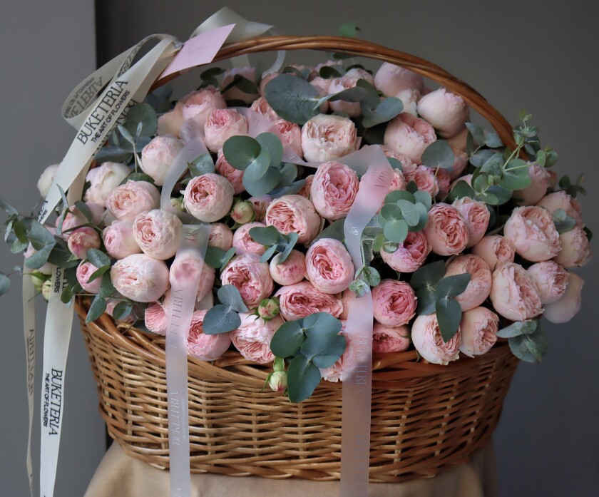 Blush garden roses in a rustic basket