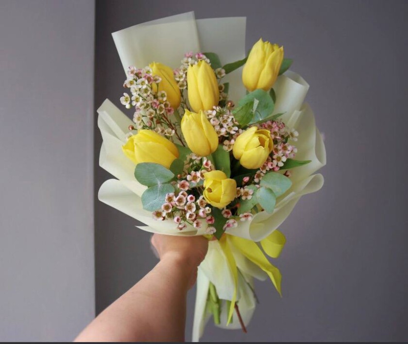 Seven yellow tulips in waterproof paper