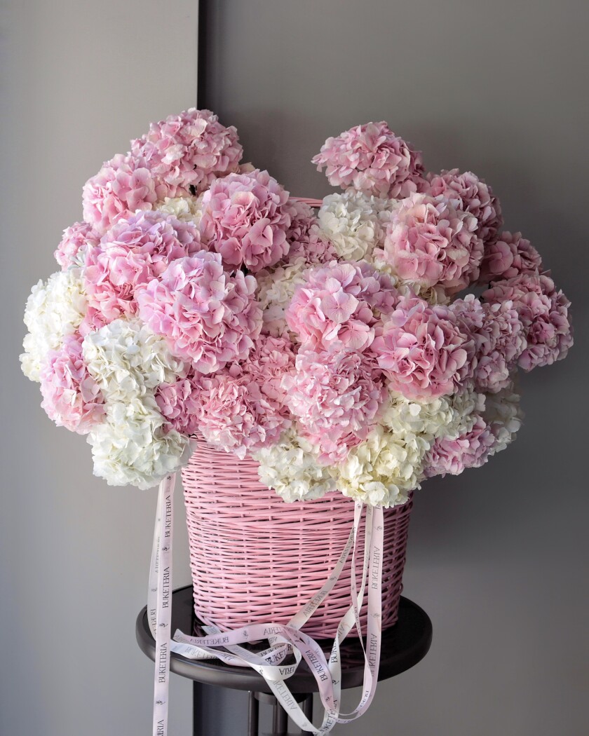 Pink hydrangea decorative arrangement in a basket
