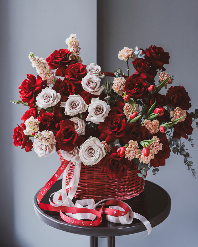 Nineteen red hybrid tea roses with nine dusty pink garden roses