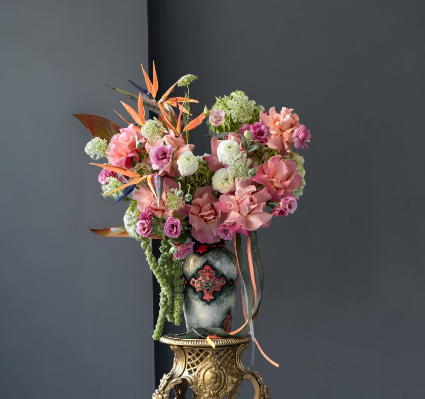 Four strelitzia with hydrangea and peach garden roses