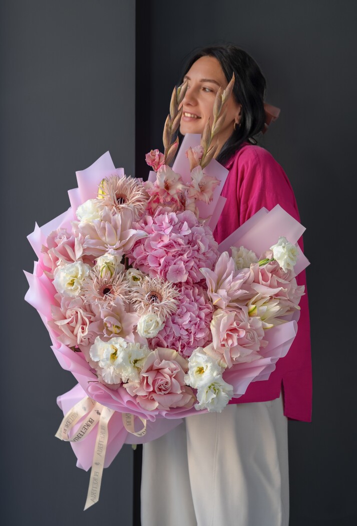Two pink hydrangeas with pink garden roses and blush lisianthus