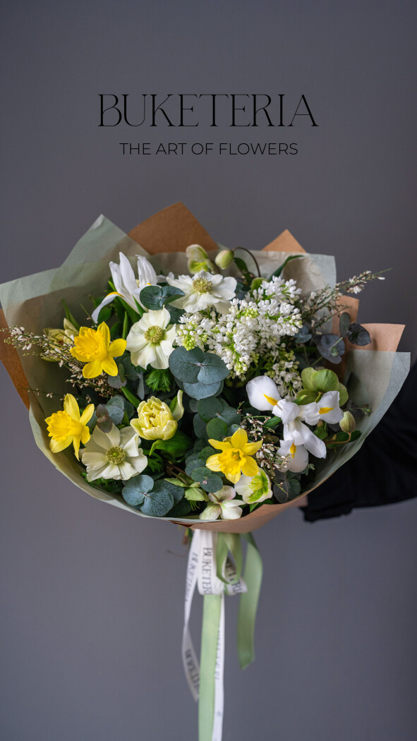 Spring bouquet of white hellebores and yellow tulips