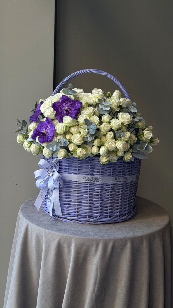 Elegant white spray roses in a rustic basket
