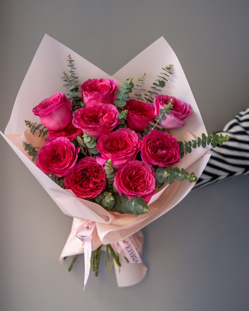 Eleven hot pink garden roses in waterproof paper