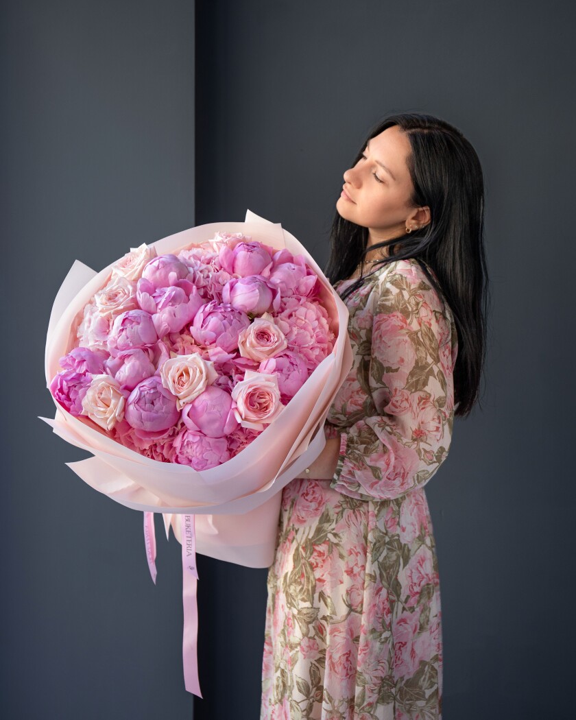 Light pink peonies with pink hydrangeas and blush garden roses