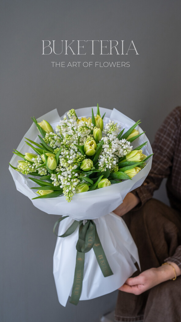 Fifteen yellow double tulips and three white lilacs