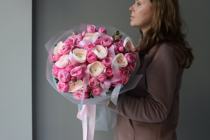 Pink spray roses and cream ranunculus bouquet