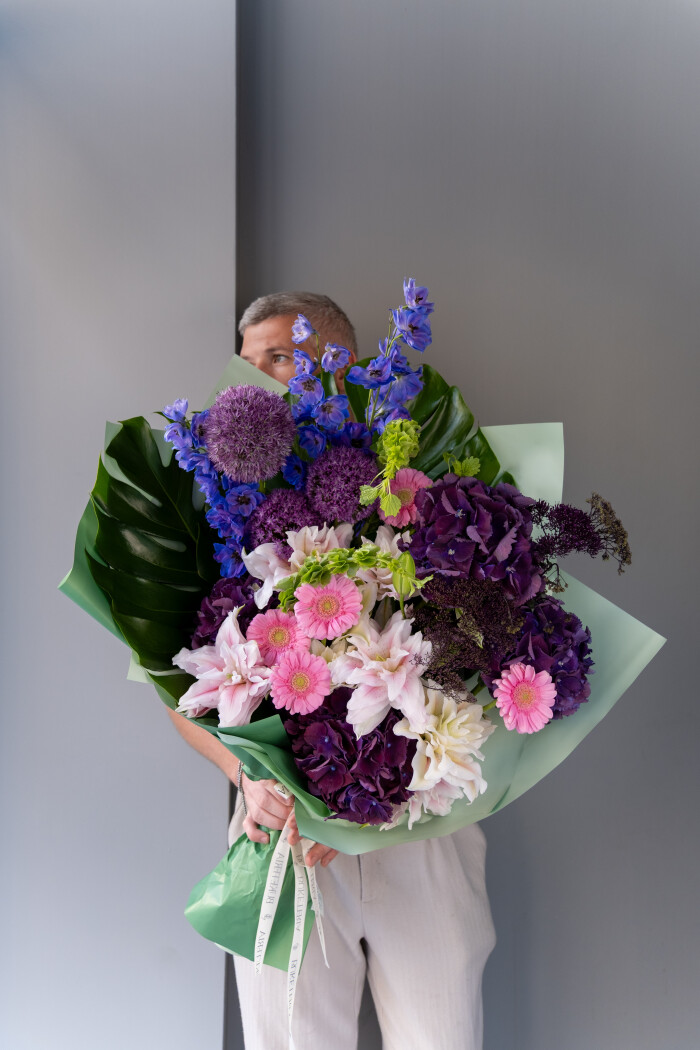 Five lilac hydrangeas with blue delphiniums and purple alliums