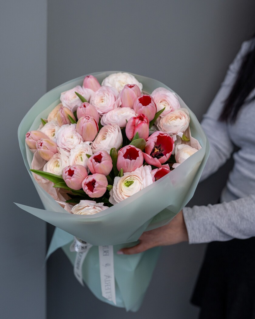 Spring bouquet of white ranunculus and pink tulips