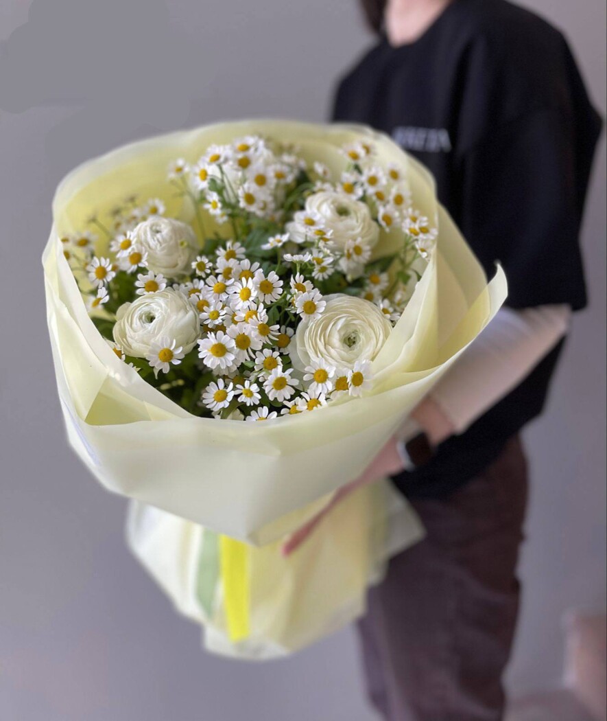 Five white ranunculus in waterproof paper