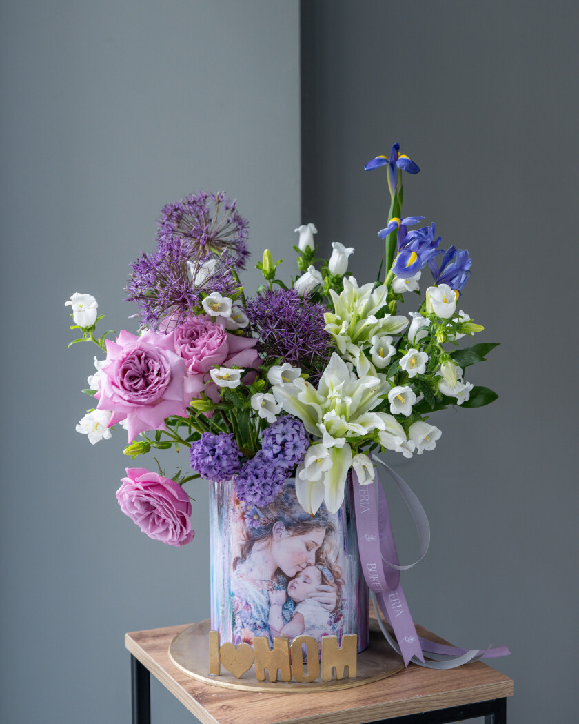 Decorative composition of light blue muscari and purple allium