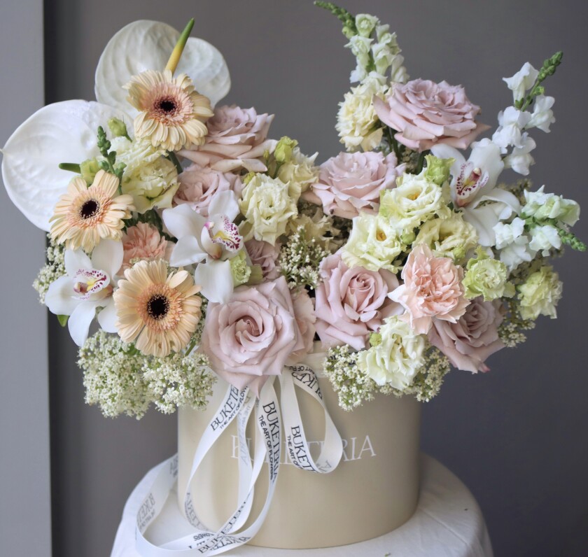 Nine dusty pink garden roses with lilacs and delphiniums