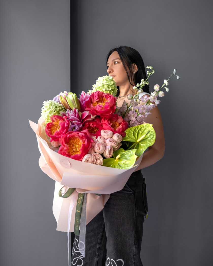 Pink peonies with green hydrangeas and coral garden roses