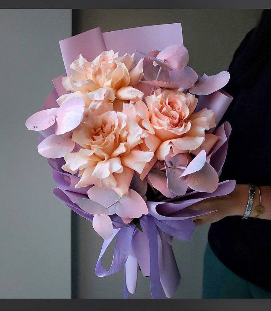 Peach garden roses with silver dollar eucalyptus