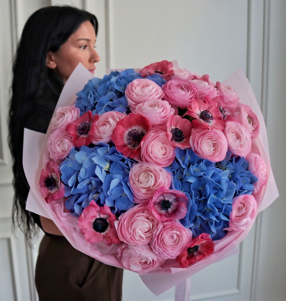Mixed bouquet of light pink ranunculus and hot pink anemones