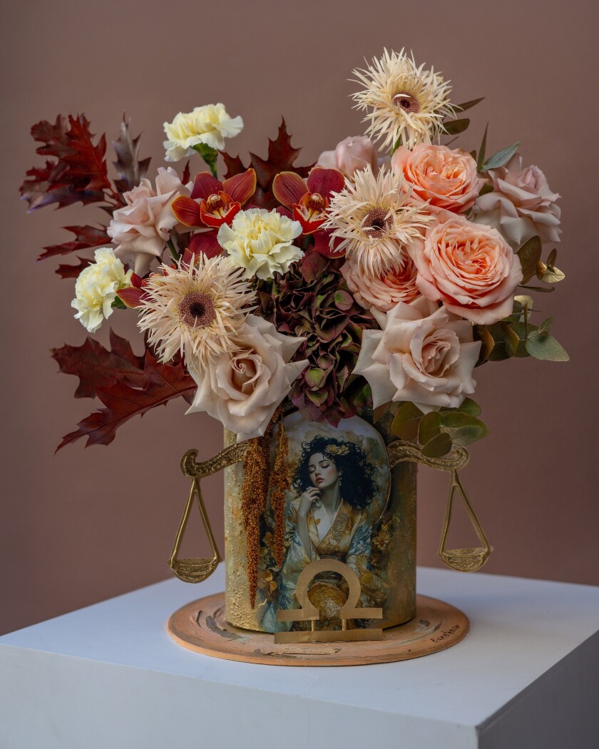 Eight cream garden roses with white gerberas and burgundy hydrangea