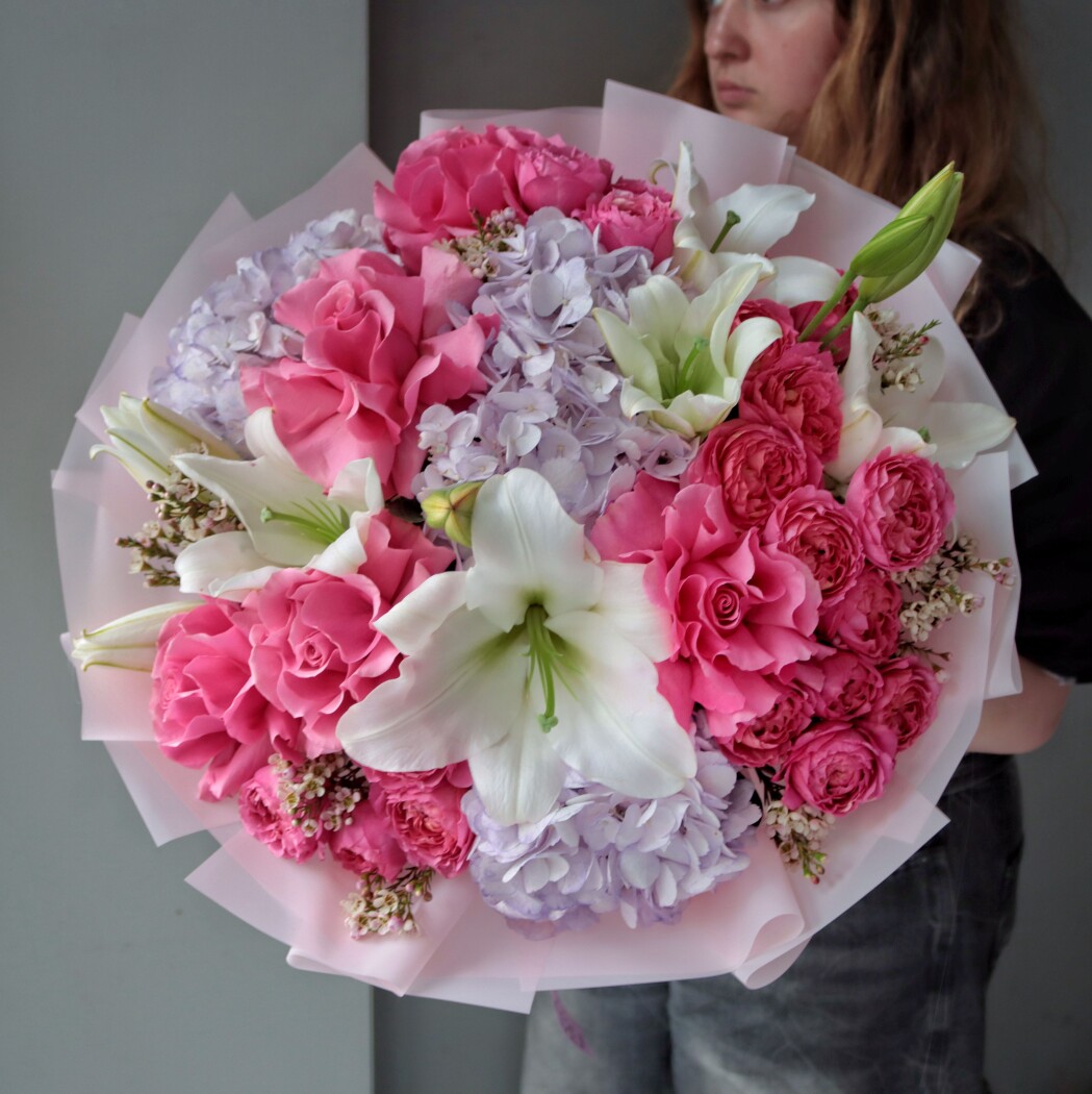 Mixed bouquet of light blue hydrangeas and pink roses