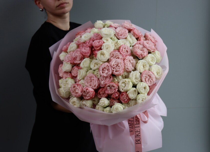 Light pink and cream spray roses in waterproof paper