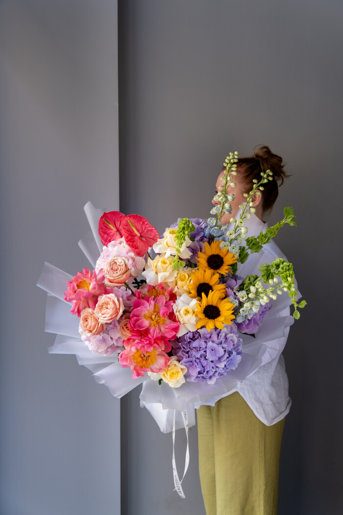 Mixed bouquet of lilac hydrangeas and coral peonies