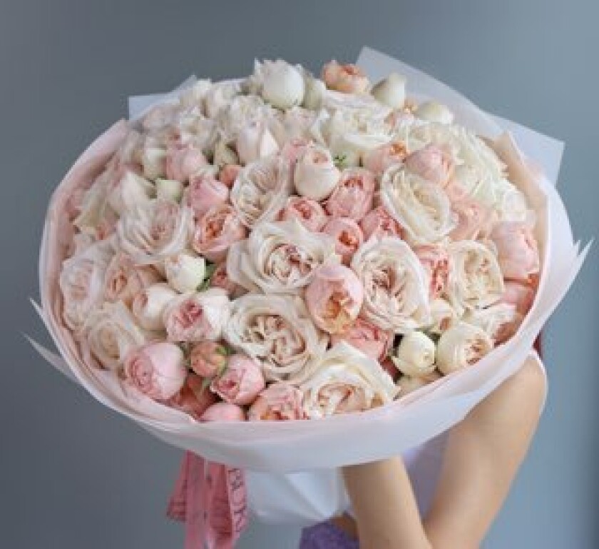 Thirteen blush spray roses with cream and dusty pink garden roses