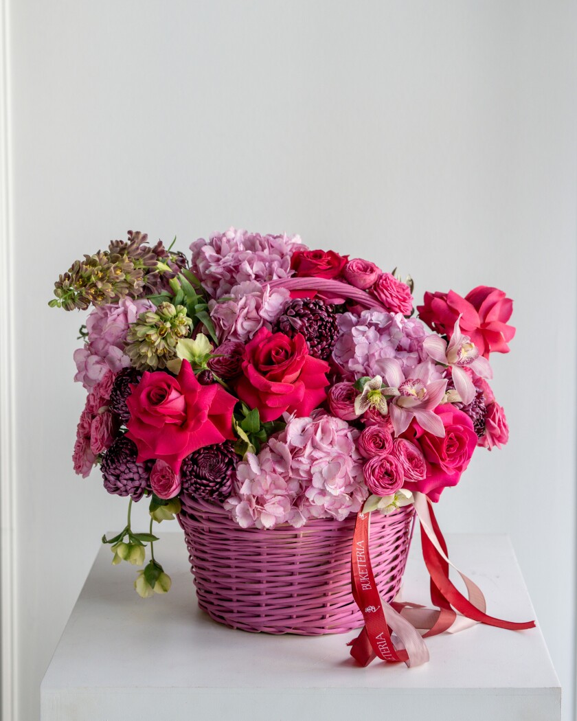 Light pink hydrangeas with purple fritillaria and deep pink roses