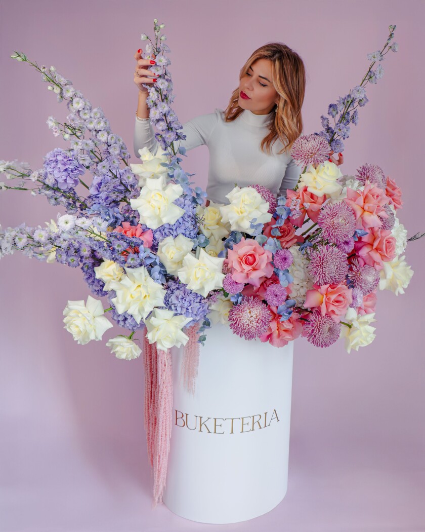 Peach garden roses with white hydrangeas and lavender delphiniums