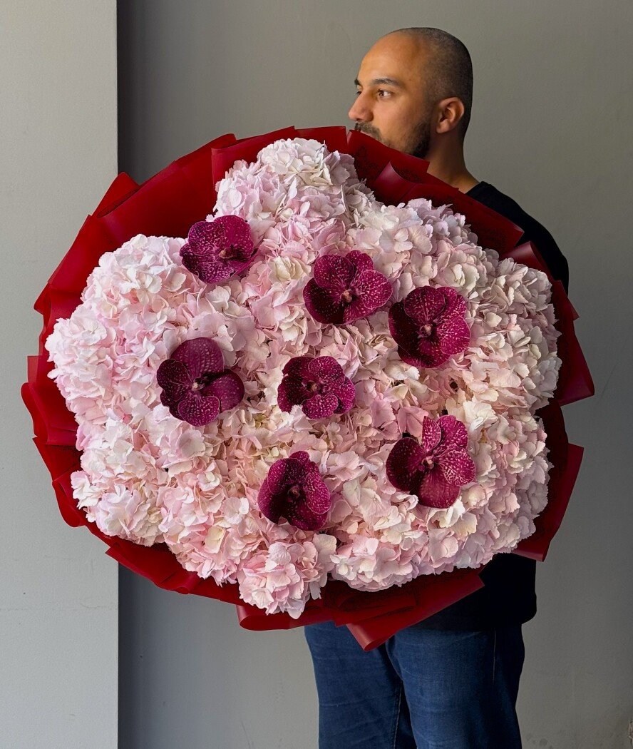 Pink hydrangeas with purple vanda orchids