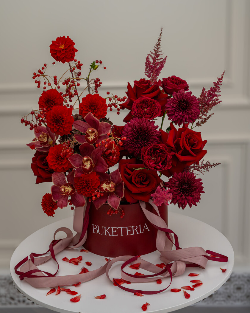 Romantic bouquet of dark red dahlias and red roses