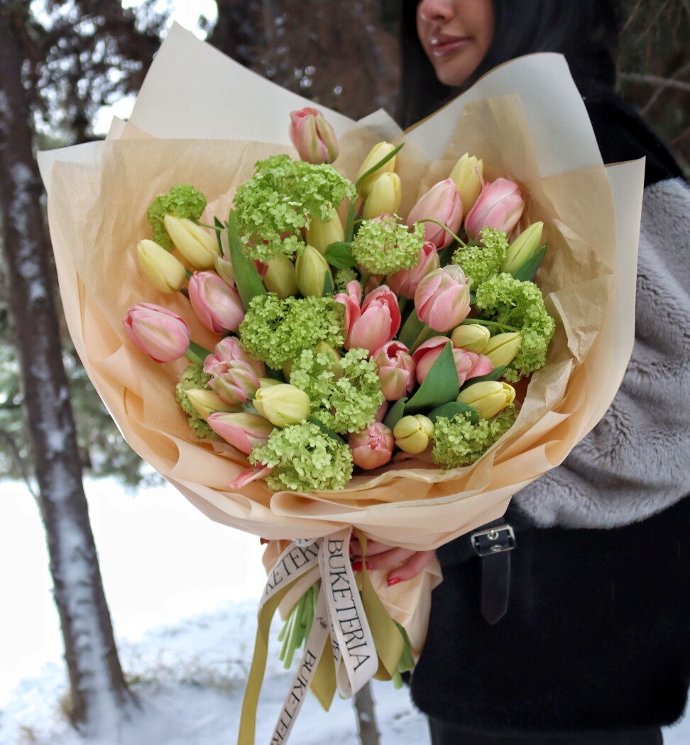 Light pink tulips with green viburnum
