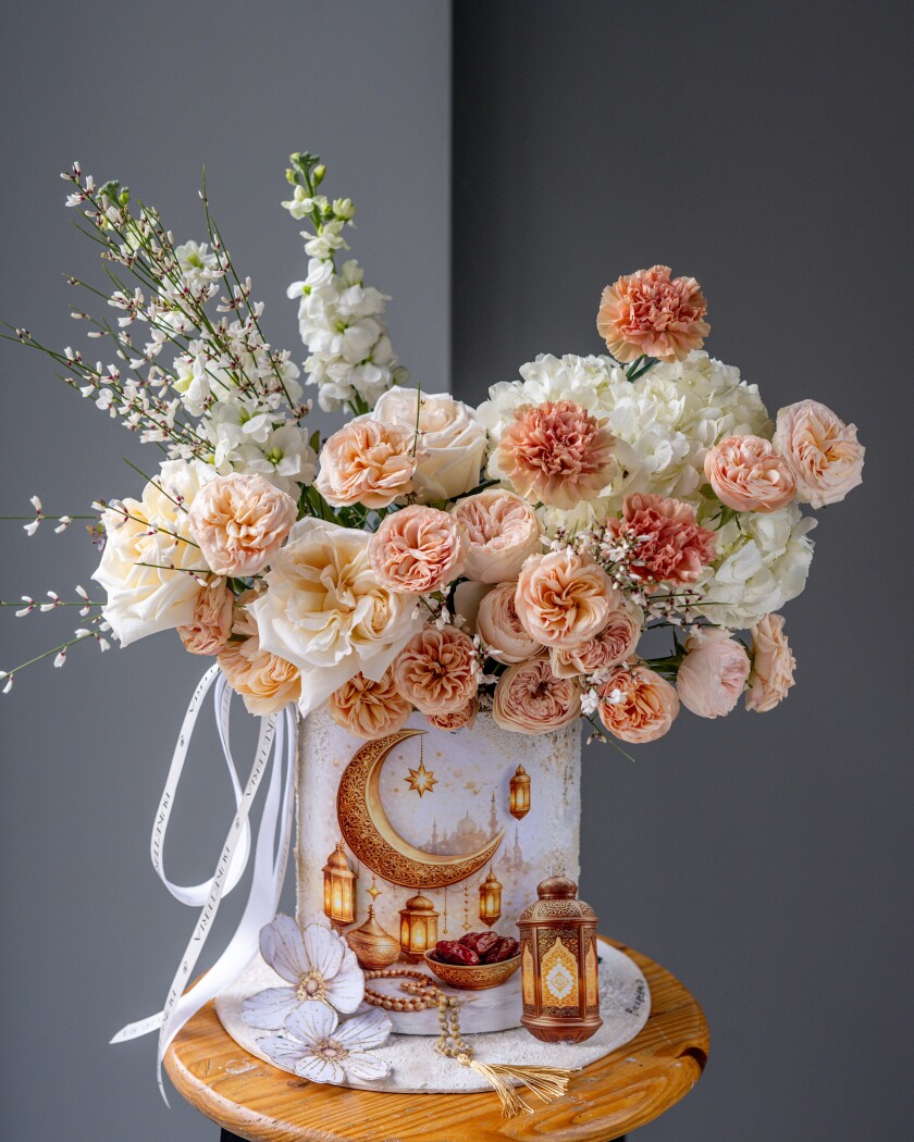 Peach spray roses with cream garden roses and white hydrangea