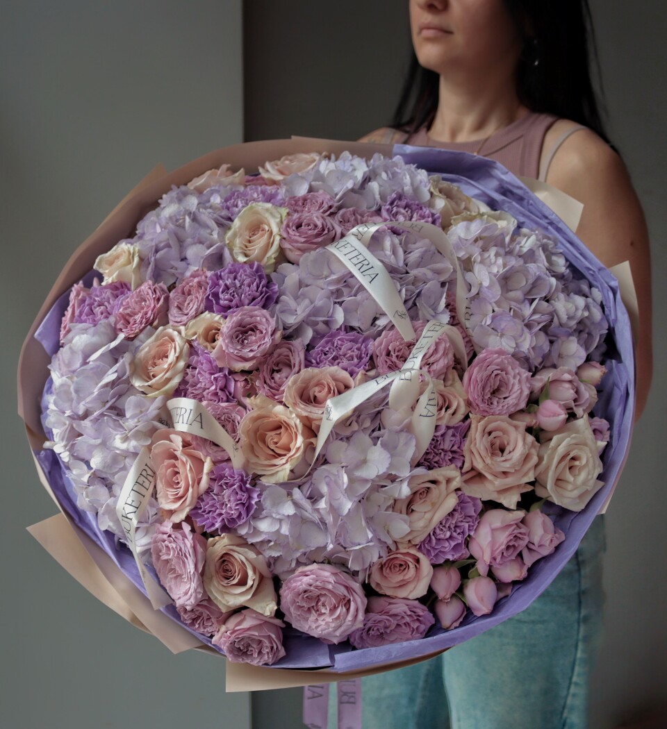 Mixed bouquet of light blue hydrangeas and pink roses