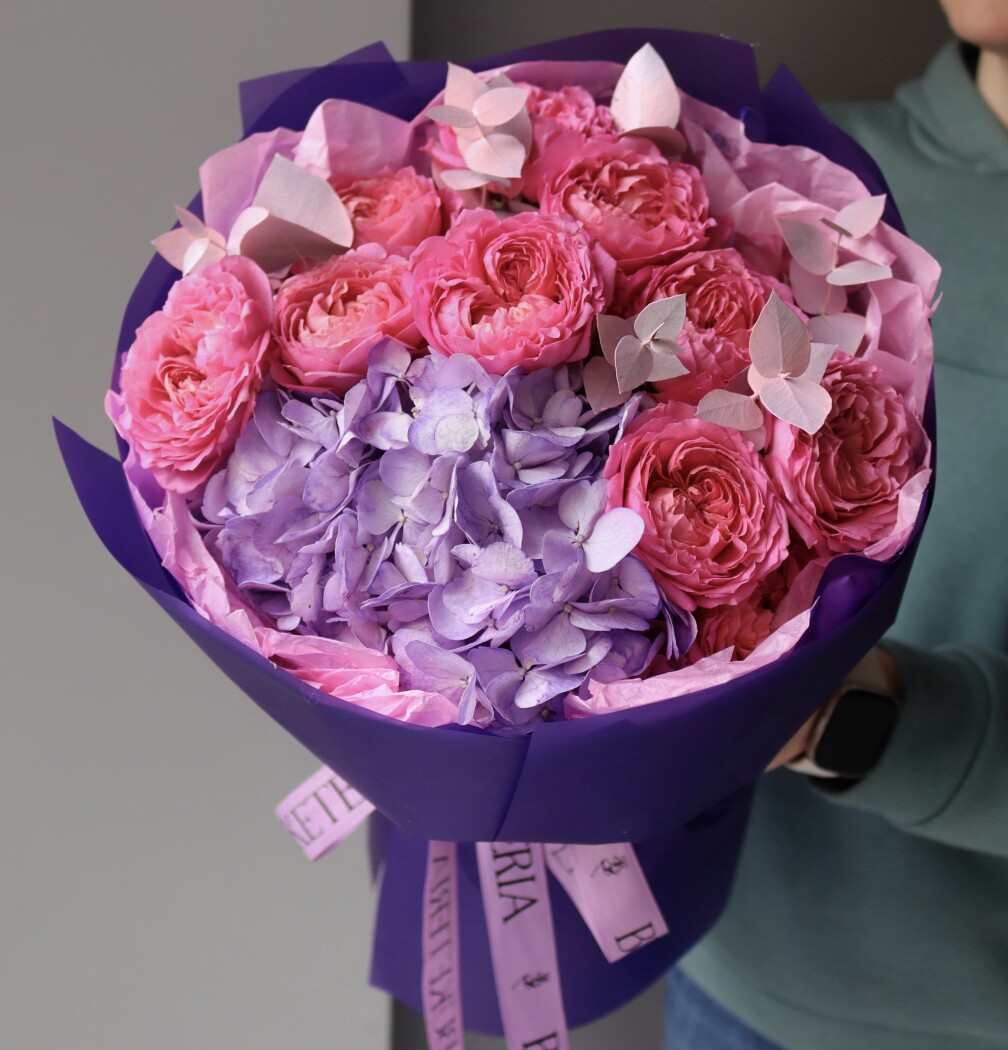 Mixed bouquet of hot pink spray roses and light blue hydrangea