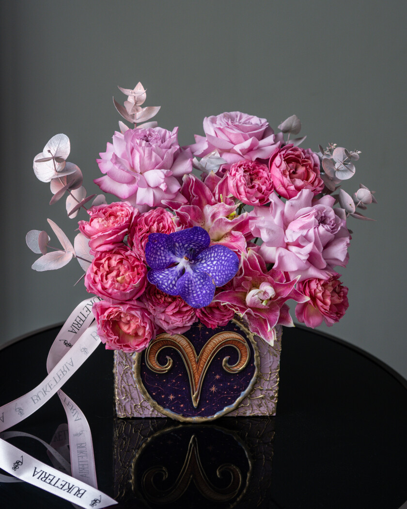 Decorative composition of blush spray roses and cream oriental lily